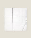 white quiltino with charcoal embroidery