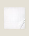 white quiltino with white embroidery